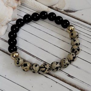 Dalmatian and black agate with gold beads. Beads are 8mm.
